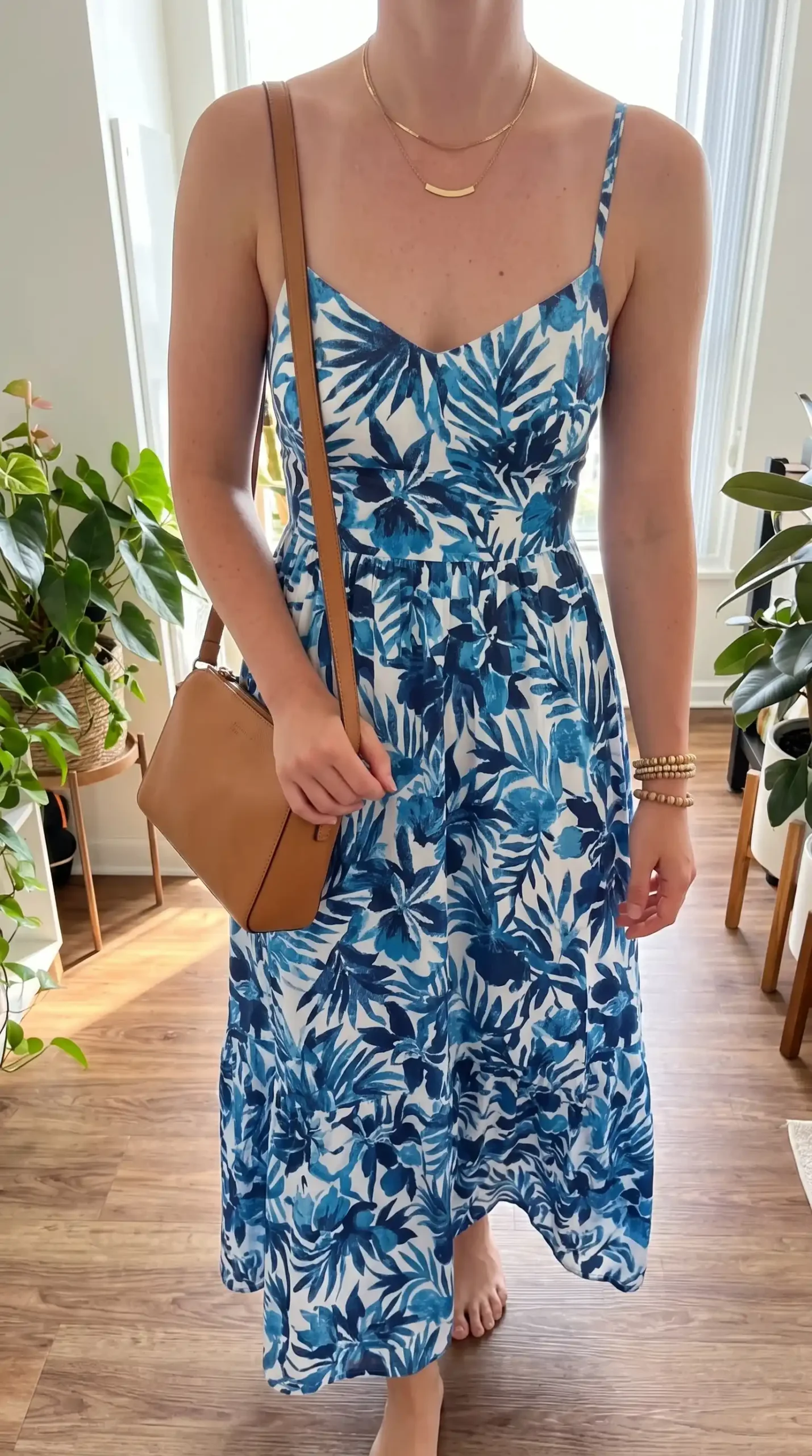 woman wearing blue and white tropical palm print maxi dress