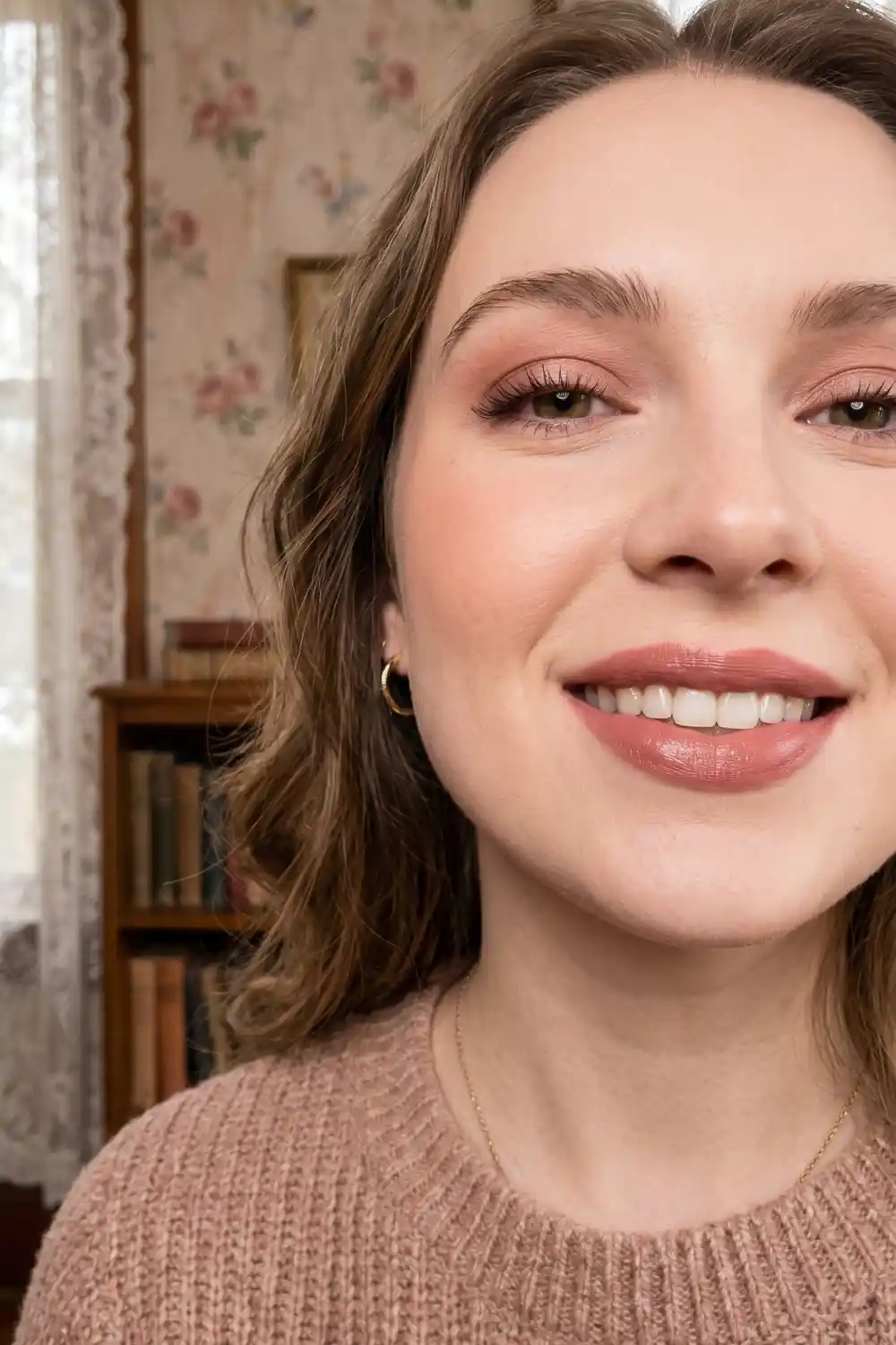 Woman wearing nude rose warm dusty rose satin lipstick with soft romantic makeup