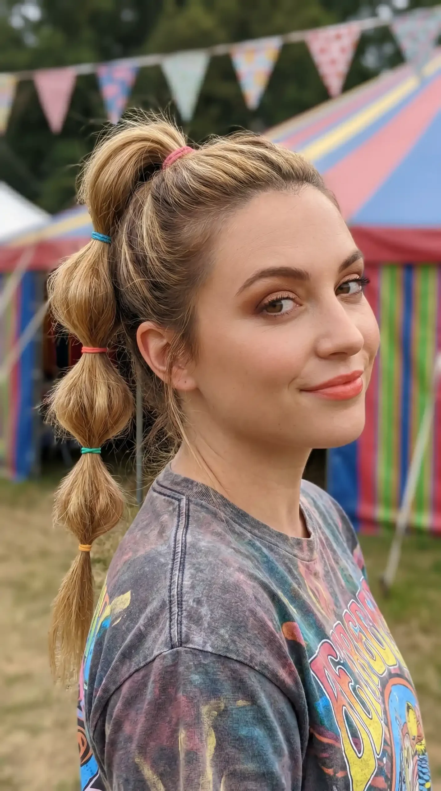 Woman with caramel blonde bubble ponytail hairstyle