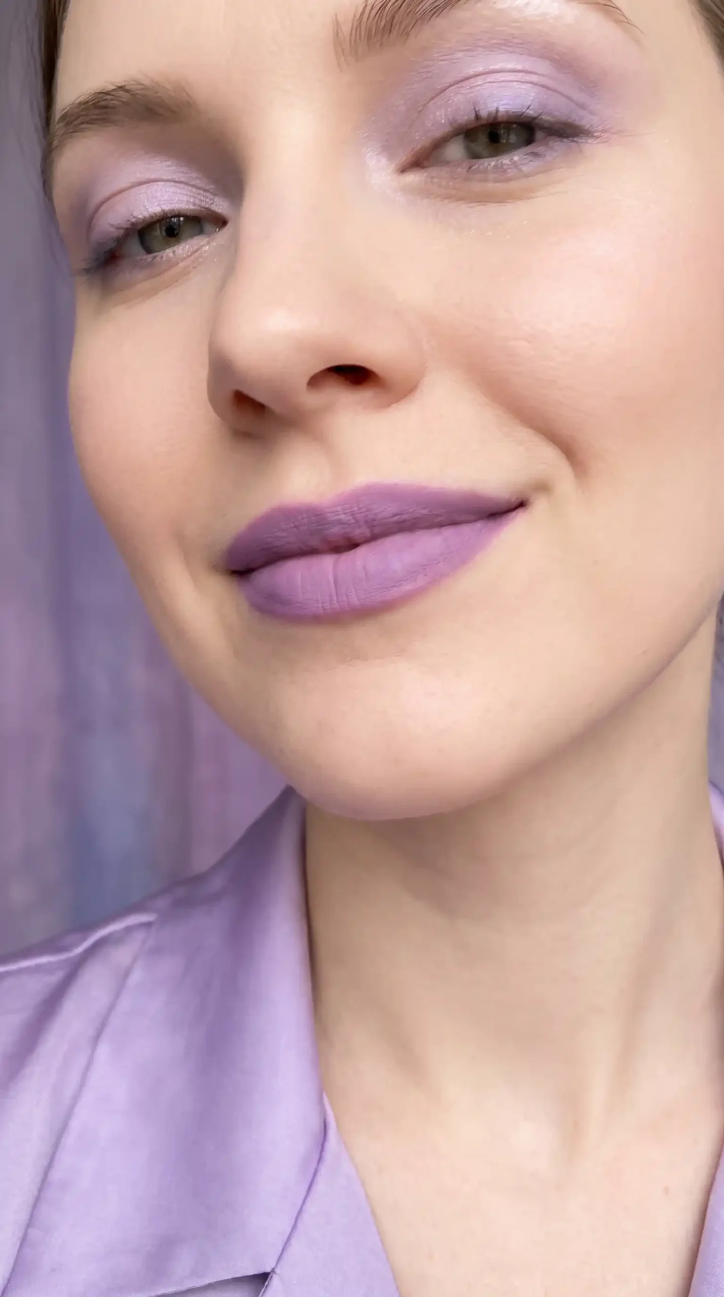 Woman wearing lilac purple soft cool velvet matte lipstick with dreamy makeup