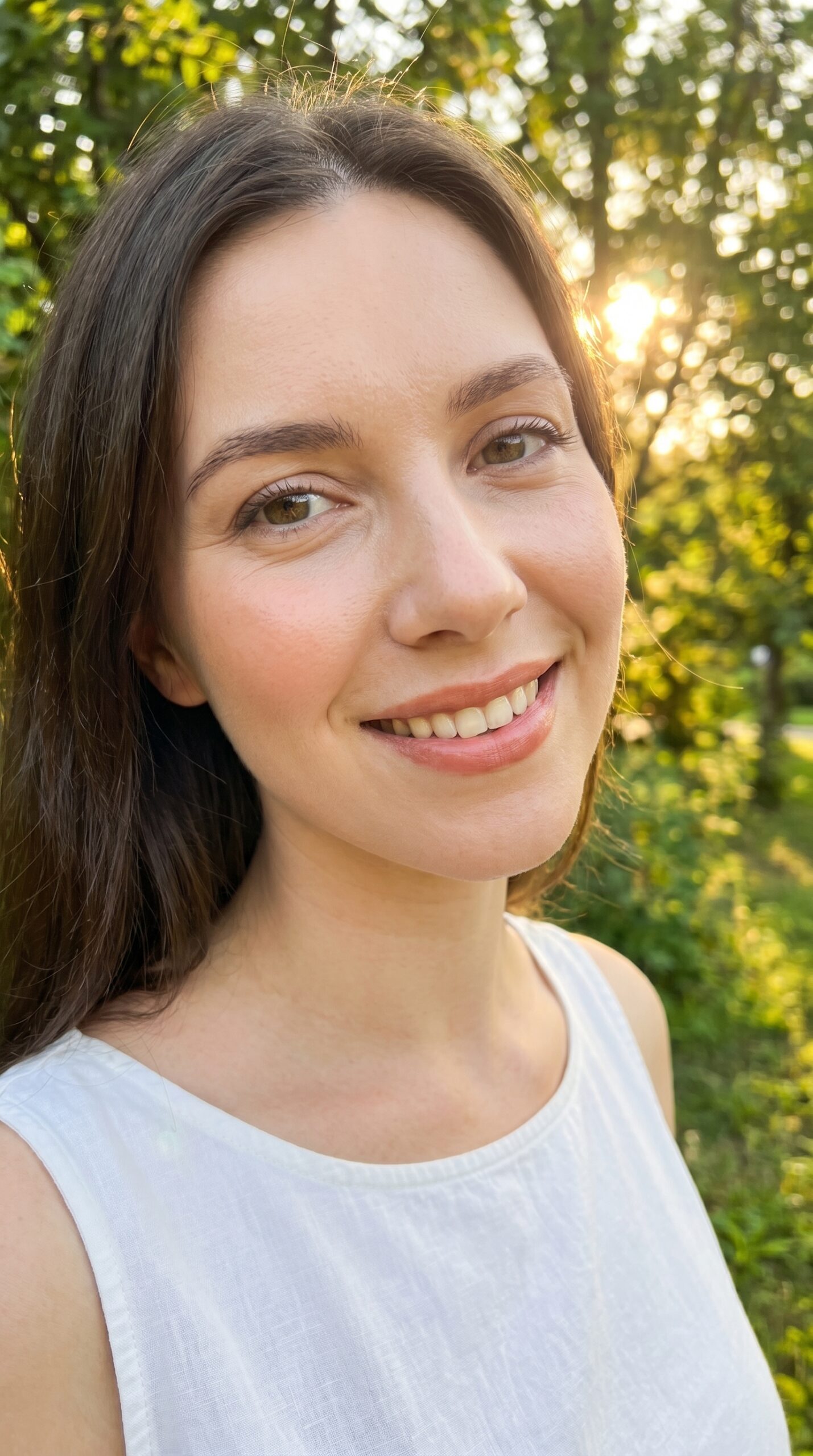 Woman wearing soft coral nude warm peachy glossy cream lipstick
